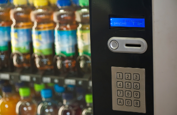 A vending machine provides various beverages