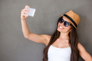 Selfie, girl, hat, smiling, glasses, sunglasses, woman, studio.