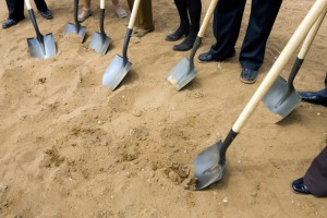 New location, grand opening, opening, breaking ground, ceremony, new business, shovel, dirt.