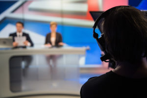 cameraman, newsroom, television station, anchors, desk
