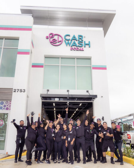El Car Wash Doral team poses together as they celebrate the grand opening of the newest location.